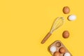 Baking ingredients, cooking utensil and open notebook on yellow background. Template for cooking recipes or your design. Top view Royalty Free Stock Photo