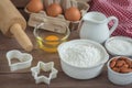 Baking ingredients flour, egg, milk, almonds, sugar on table