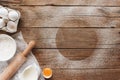 Baking concept flat lay. Ingredients, kitchen utensils, wooden background