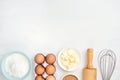 Baking ingredients and kitchen utensils on white background