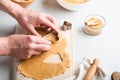 Baking ingredients and kitchen utensils on a white background top view. Female or man hands preparing heart sugar cookies. Baking Royalty Free Stock Photo