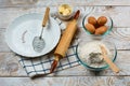 Baking ingredients placed on kitchen table, ready for cooking. Copyspace for text. Concept of food preparation, kitchen on backgro Royalty Free Stock Photo