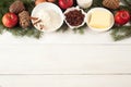 Baking ingredients on white table. eggs, butter, spice, apples, raisins, vanilla and cinnamon sticks, white flour and xmas tree Royalty Free Stock Photo