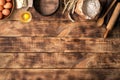 Baking ingredients on a wooden table with copy space