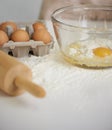 Baking, kitchen and eggs in bowl with flour for cake, bread and pastry preparation in home. Culinary, bakery and closeup Royalty Free Stock Photo