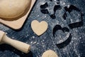 Baking love heart cookies for Valentine day. Top view. Making heart shaped cookies with cutters Royalty Free Stock Photo