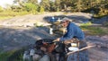 Baking pancake in fire is quite common in summertime, in small islands in Finland Royalty Free Stock Photo