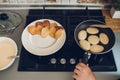 Baking pancakes in modern kitchen. Steps of making cooking pancake at home. Stay home, isolation concept Royalty Free Stock Photo