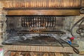 Baking patatoes and meat in an open fire oven Royalty Free Stock Photo