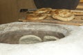 Baking pita bread in a stone oven Royalty Free Stock Photo