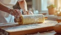 Baking process - Rolling dough with flour on a wooden board Royalty Free Stock Photo