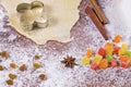 Baking scenery with flower shaped cookie cutter, rolled pastry, wheat flour, candied fruit, icing sugar and Japanese star anise. Royalty Free Stock Photo