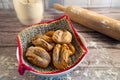 Baking situation: ready-to-serve French rolls with rolling pin and flour Royalty Free Stock Photo