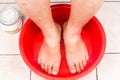 Baking soda being used as feet bath at home. Royalty Free Stock Photo