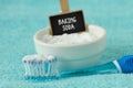 Baking soda in a bowl with a toothbrush - Teeth whitening