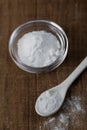 Baking soda, Sodium bicarbonate in glass bowl and spoon on table Royalty Free Stock Photo