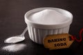 Baking soda in white bowl on black background Royalty Free Stock Photo