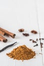 Baking spices like cinnamon, star anise, and vanilla bean on white wooden table Royalty Free Stock Photo