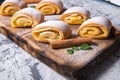 Baking strudel,rolls powdered with mint leaves tangerines,cinnamon sticks on a black and white background,on a wooden Board Royalty Free Stock Photo