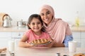 Baking Together. Portrait Of Happy Arabic Mother And Daughter Holding Homemade Pie Royalty Free Stock Photo