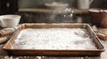 A baking tray with a dusting of flour on a light surface Royalty Free Stock Photo