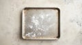 A baking tray with a dusting of flour on a light surface Royalty Free Stock Photo