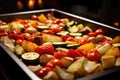 baking tray full of roasting vegetables in the oven Royalty Free Stock Photo