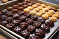 baking tray full of unbaked chocolate-filled pastries