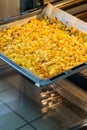 Baking tray with golden roasted potatoes