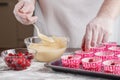 Baking Trays With Raw Muffin Dough In Paper Cases