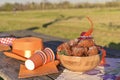 Baking and various foods and drinks for lunch on the nature. Oranjevaya hat and accessories. Traditional donuts for King`s Day Royalty Free Stock Photo