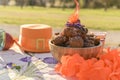 Baking and various foods and drinks for lunch on the nature. Oranjevaya hat and accessories. Traditional donuts for King`s Day Royalty Free Stock Photo