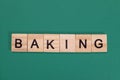 Baking word from wooden letters on green background Royalty Free Stock Photo
