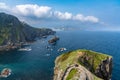 Long and winding stone stairs leading up to the Church of San Juan de Gaztelugatxe with a view of the coast of the Spanish Basque