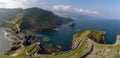 Long and winding stone stairs leading up to the Church of San Juan de Gaztelugatxe with a view of the coast of the Spanish Basque