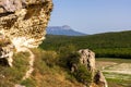 Bakla is ancient cave town in Crimea. Scenic sunny day landscape of Bakla under blue sky