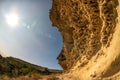 Bakla is ancient cave town in Crimea. Scenic sunny day view of Bakla under blue sky