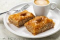 Baklava and espresso coffee. Layered pastry dessert made of filo pastry Royalty Free Stock Photo