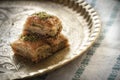 Baklava with pistachio on a golden tray with oriental patterns Royalty Free Stock Photo