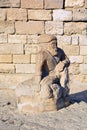 Ancient statue In old town at the base of Maiden