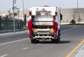 Garbage collection service, A waste collector working on emptying garbage cans for garbage collection with waste loading on a truc