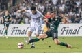 Ferencvaros right-back Endre Botka against Qarabag winger Abdellah Zoubir during UEFA Champions League qualification match Qarabag Royalty Free Stock Photo