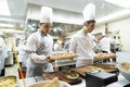 BAKU, AZERBAIJAN, JUNE 20, 2018 : catering, Famous Chef Works in a Big Restaurant Kitchen with His Help. Kitchen is Full