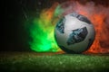 BAKU,AZERBAIJAN - JUNE 21, 2018 : Creative concept. Official Russia 2018 World Cup football ball The Adidas Telstar 18 on green gr