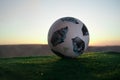 BAKU,AZERBAIJAN - JUNE 24, 2018 : Creative concept. Official Russia 2018 World Cup football ball The Adidas Telstar 18 on green gr