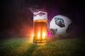 BAKU,AZERBAIJAN - JUNE 23, 2018 : Official Russia 2018 World Cup football ball The Adidas Telstar 18 and single beer glass on gree