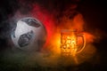 BAKU,AZERBAIJAN - JUNE 23, 2018 : Official Russia 2018 World Cup football ball The Adidas Telstar 18 and single beer glass on gree Royalty Free Stock Photo