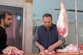 Butchers work at butcher shop