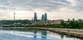 Baku, Azerbaijan- October 05, 2020: Baku Flame Towers skyscrapers, television tower and the seaside of the Caspian sea. Panorama