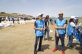 BAKU,AZERBAIJAN- 24 SEPTEMBER 2018 : Group of young students helping one another to clean up the beach, safe ecology